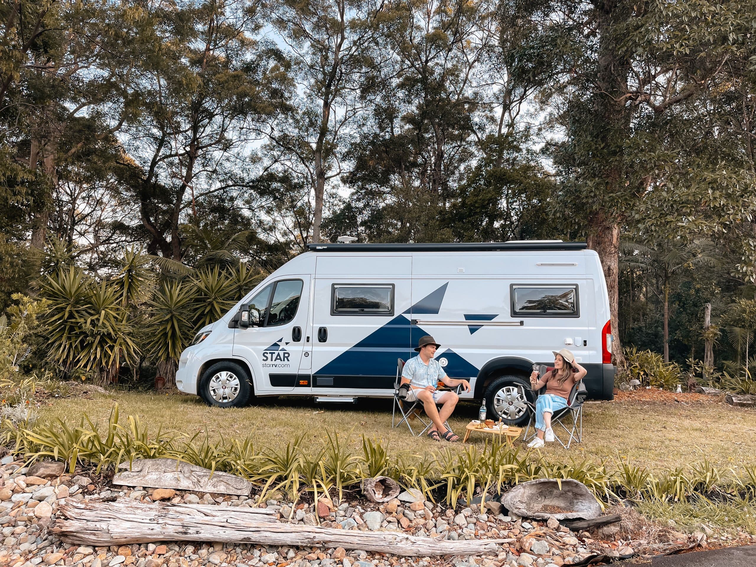 Couple having a picnic outside a P2 motorhome