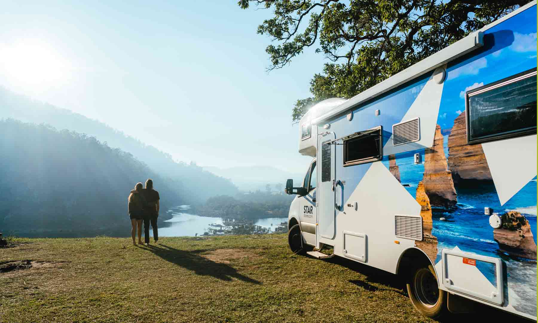 Couple admiring views by Star RV motorhome