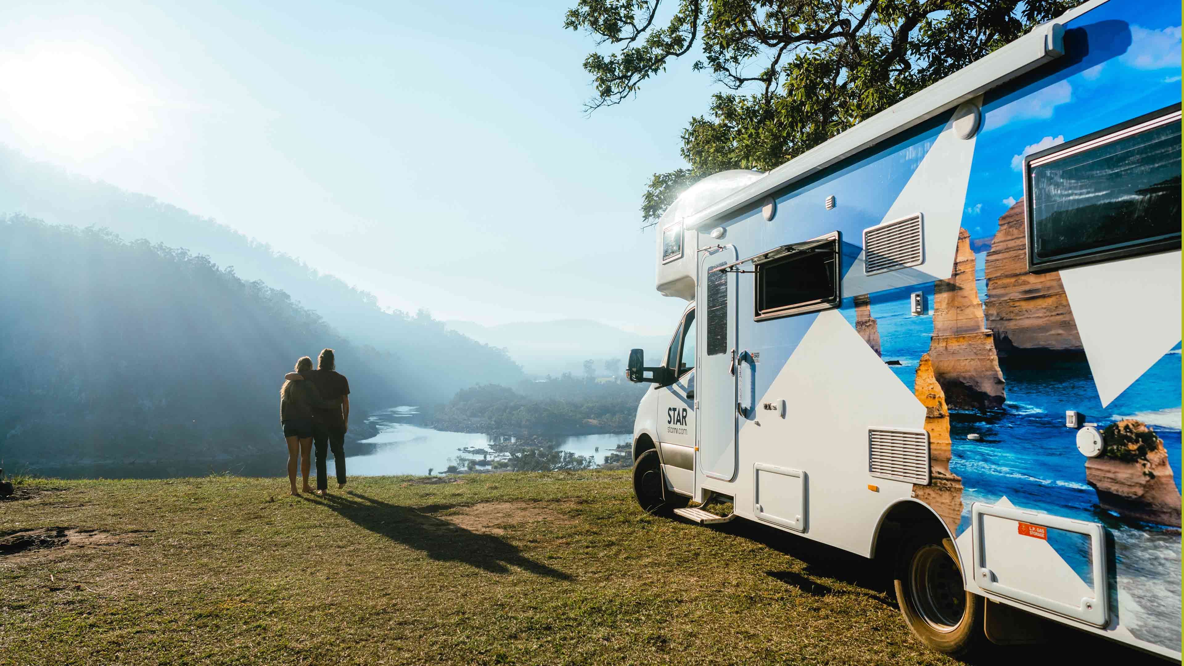 Couple admiring views by Star RV motorhome