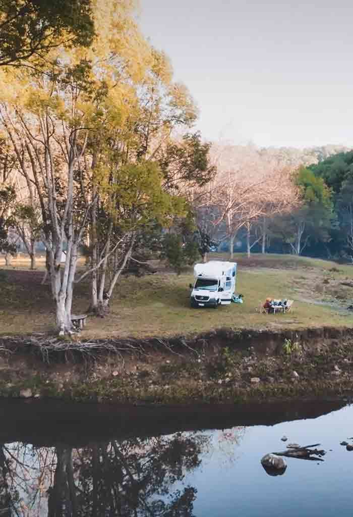 Motorhome on bank by river