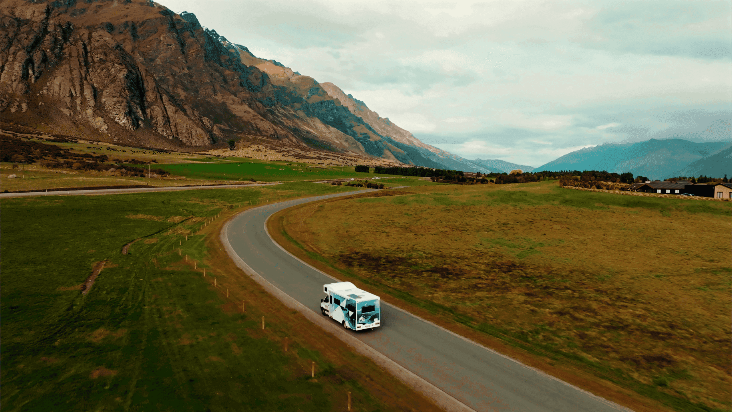 Polaris 6 motorhome driving through scenic NZ backdrop