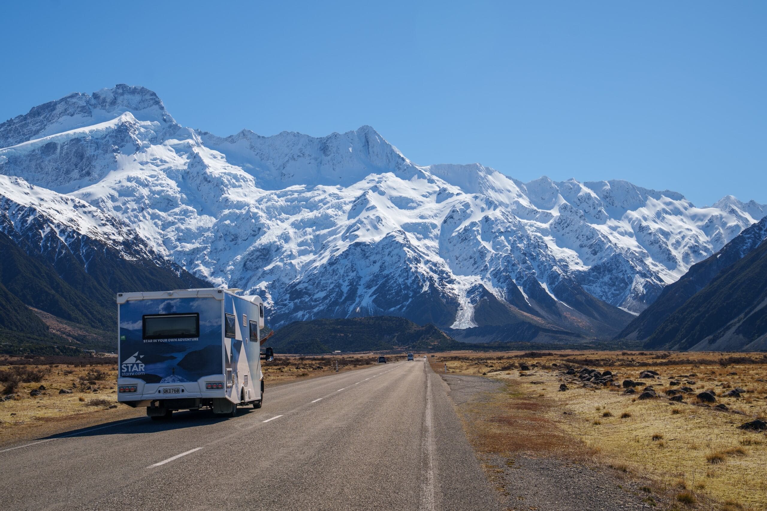 Polaris 6 motorhome driving up to snowy mountain peaks