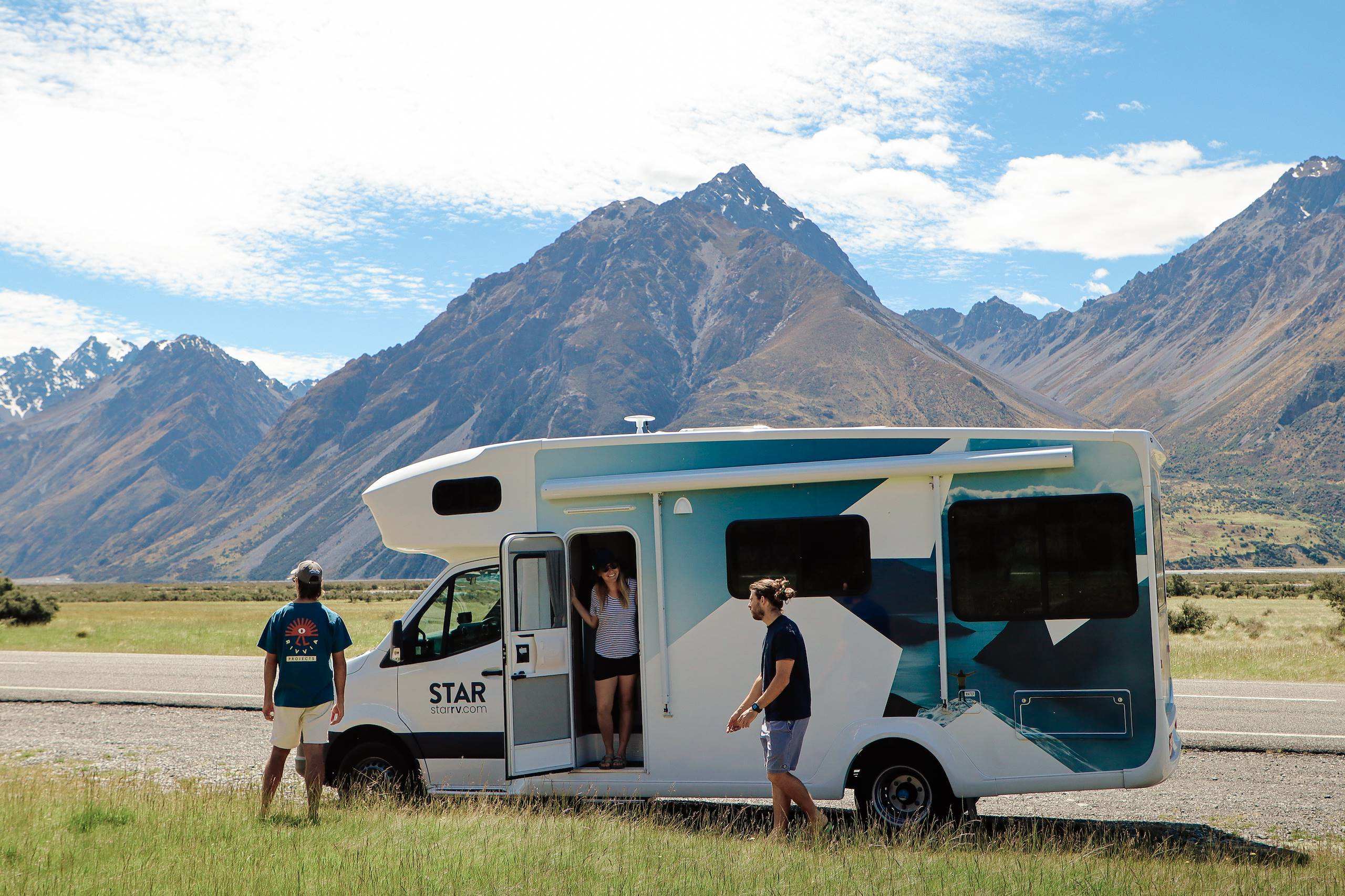 star rv polaris 4 parked next to nz mountain range with group of friends